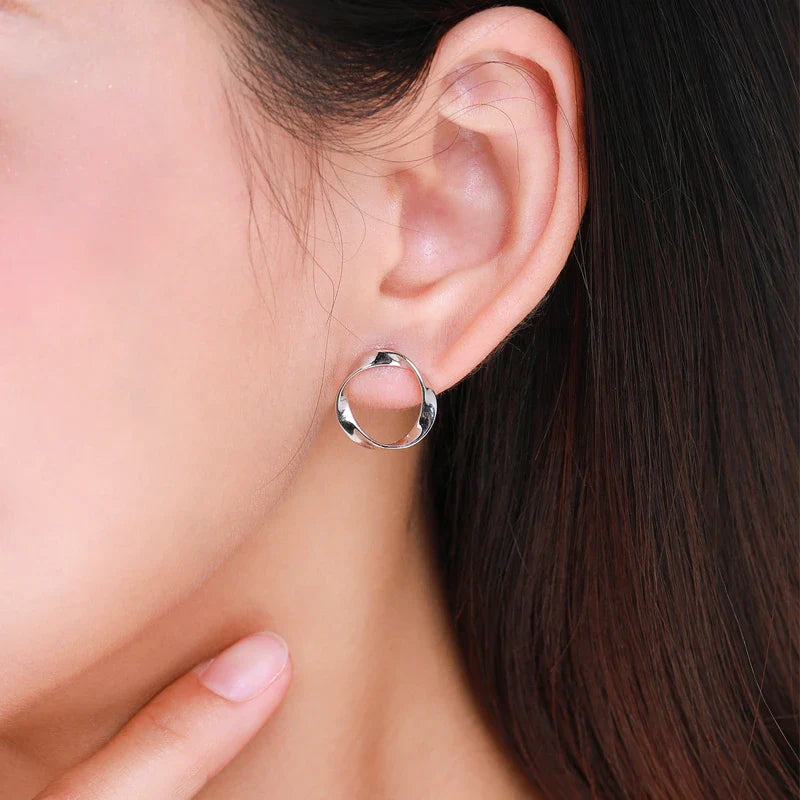 Stylish geometric silver earrings with an irregular circular design, crafted from premium 925 sterling silver for a modern, elegant look.