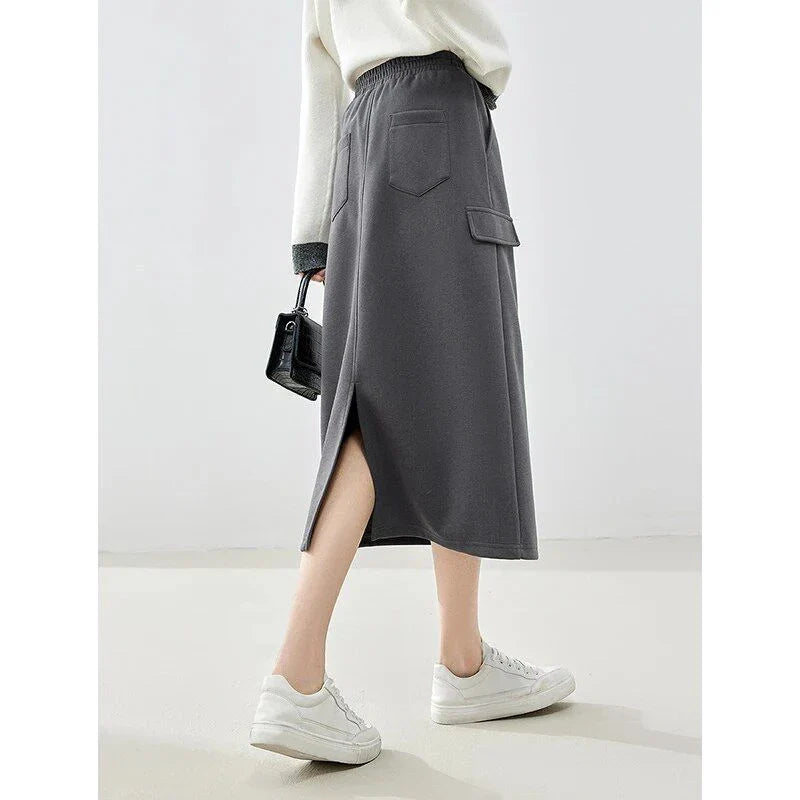 Elegant dark grey midi skirt with subtle sequin detailing, suitable for autumn and winter wear