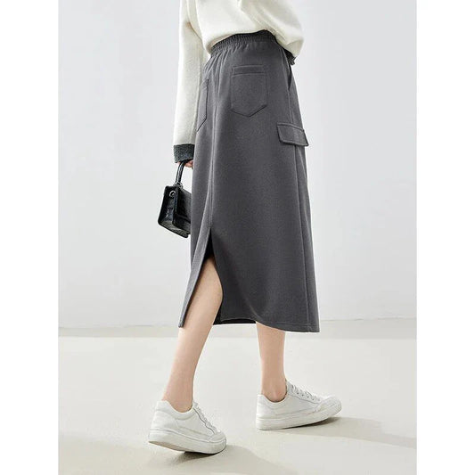 Elegant dark grey midi skirt with subtle sequin detailing, suitable for autumn and winter wear