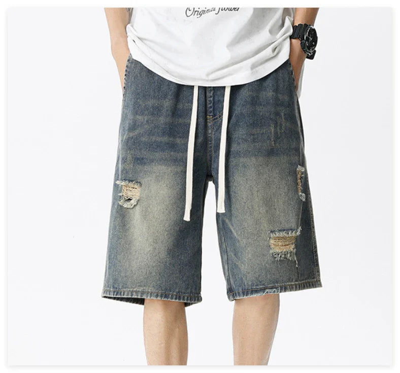 Premium British-crafted vintage-inspired ripped denim shorts for men with a straight-leg silhouette and authentic distressed details