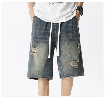 Premium British-crafted vintage-inspired ripped denim shorts for men with a straight-leg silhouette and authentic distressed details
