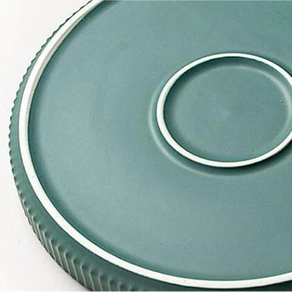 Candy-coloured ribbed ceramic tableware featuring plates, bowls, and other dining accessories in vibrant hues