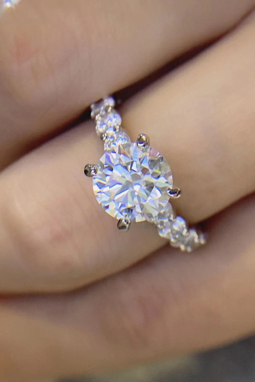 Exquisite 2-carat moissanite solitaire ring in 925 sterling silver, featuring a mesmerising centre stone and delicate metalwork for a modern, minimalist design.