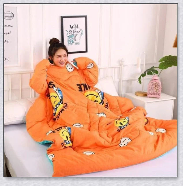 A cosy, wearable quilt with sleeves in a variety of colourful designs, perfect for staying warm and comfortable during the winter months.