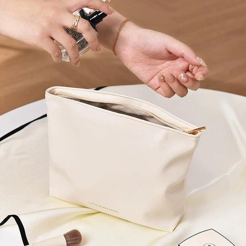 A versatile PU leather organiser bag in white and brown colours, designed to keep your daily essentials organised and your travels stylish.