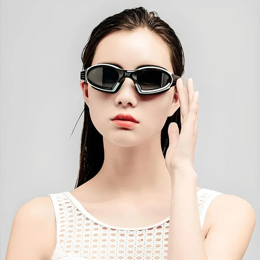 A pair of high-performance anti-fog, waterproof swimming goggles with polycarbonate lenses and a flexible silicone frame, designed for optimal clarity and comfort during swimming activities.