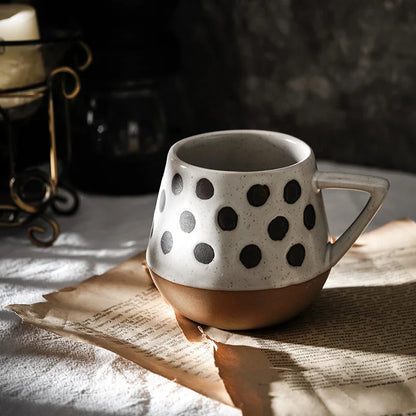 A hand-painted ceramic mug featuring a unique Nordic-inspired design, perfect for enjoying coffee, tea, or other beverages