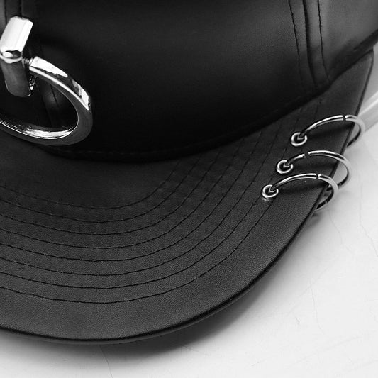 A stylish black flat-brimmed cap with a Korean-inspired design, featuring an adjustable elastic band for a comfortable fit.