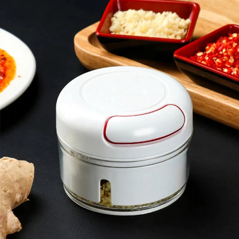 A high-quality manual food processor with sharp blades for effortlessly chopping, mincing, and processing a variety of ingredients.