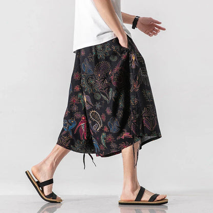 Men's loose-fitting Chinese-inspired cropped pants with a dragon or elephant floral pattern in navy blue, red, or coffee colours