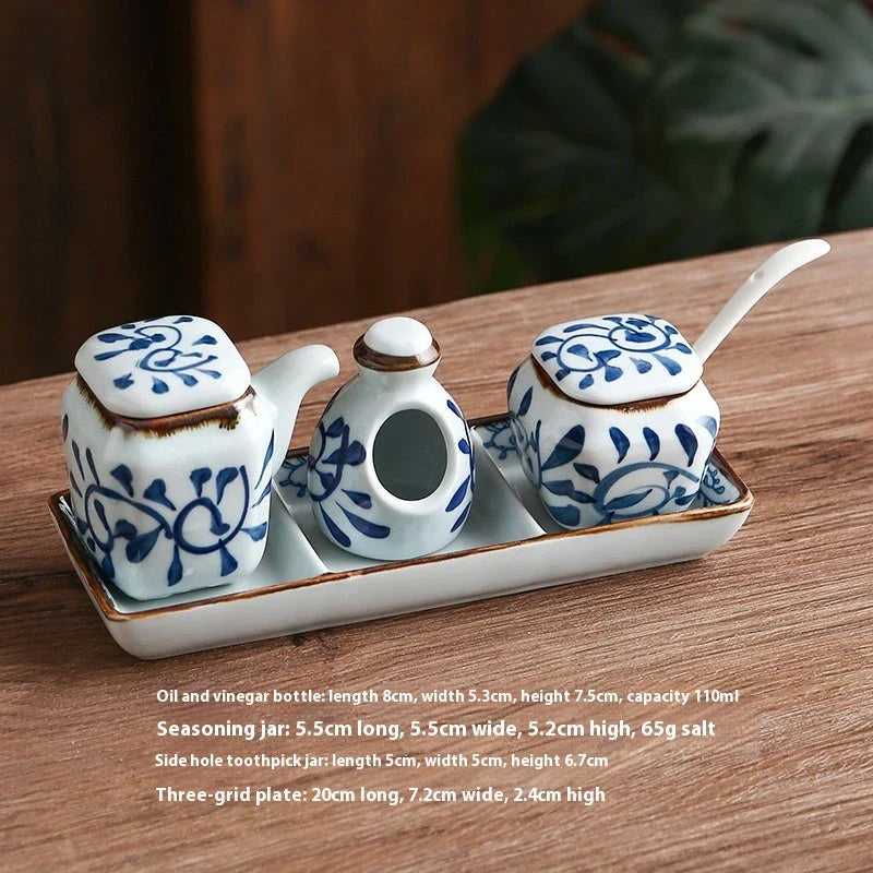 Premium four-piece ceramic seasoning set with oil, vinegar, seasoning, and toothpick holder for a stylish and organized kitchen