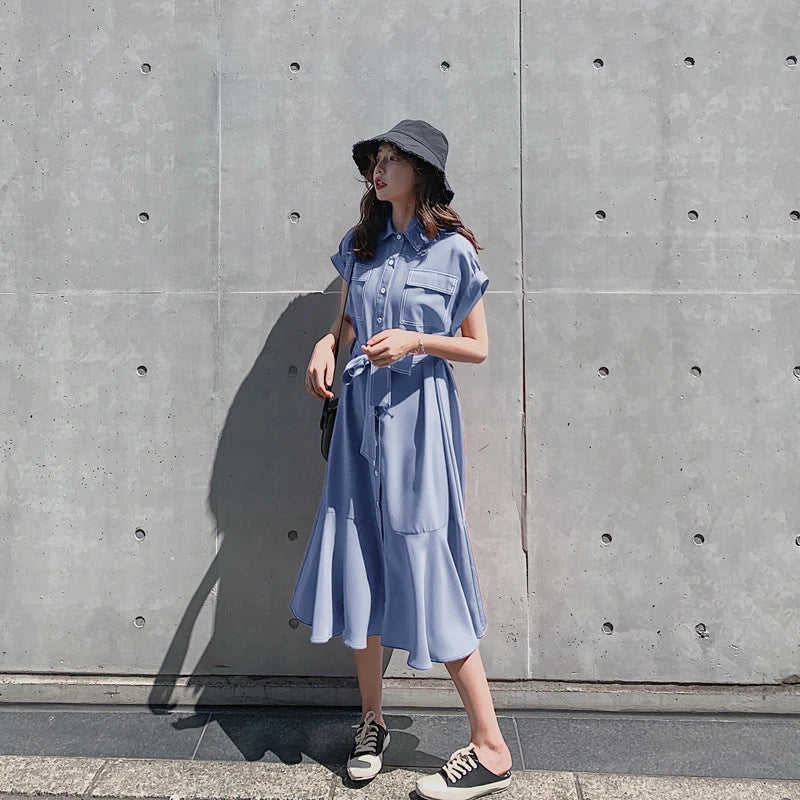 Elegant Hepburn-inspired fishtail shirt dress in blue, featuring a classic shirt design and flattering fishtail silhouette for a timeless British style.