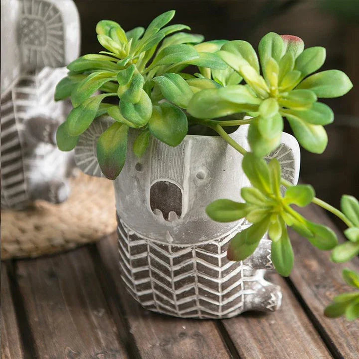 Charming retro koala-shaped cement planter for succulents and small flowers, available in two sizes