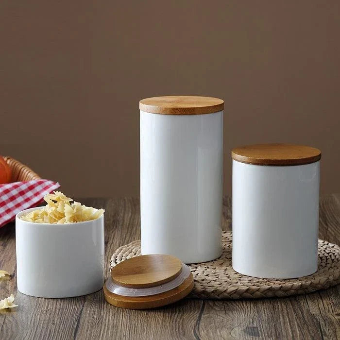 A ceramic kitchen jar with a bamboo lid, available in three sizes to suit your storage needs