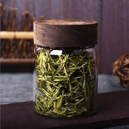 Premium glass storage jars with wooden lids in various sizes, designed for stylish and functional kitchen organisation