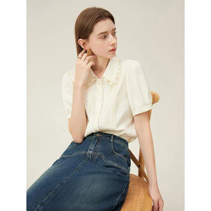 Elegant embroidered polo-neck blouse with petal sleeves, perfect for British summer fashion