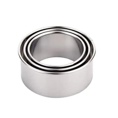 Premium stainless steel dumpling maker set with three distinct mold sizes for creating a variety of dumpling shapes