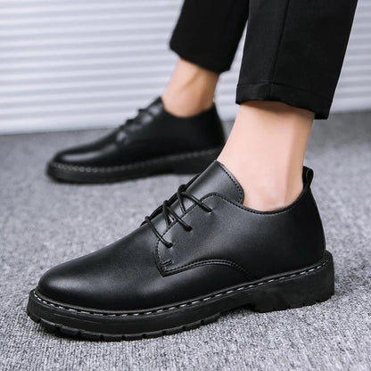 Sleek and sophisticated premium leather dress shoes in a dark skin black colourway, featuring a crocodile pattern and durable rubber sole