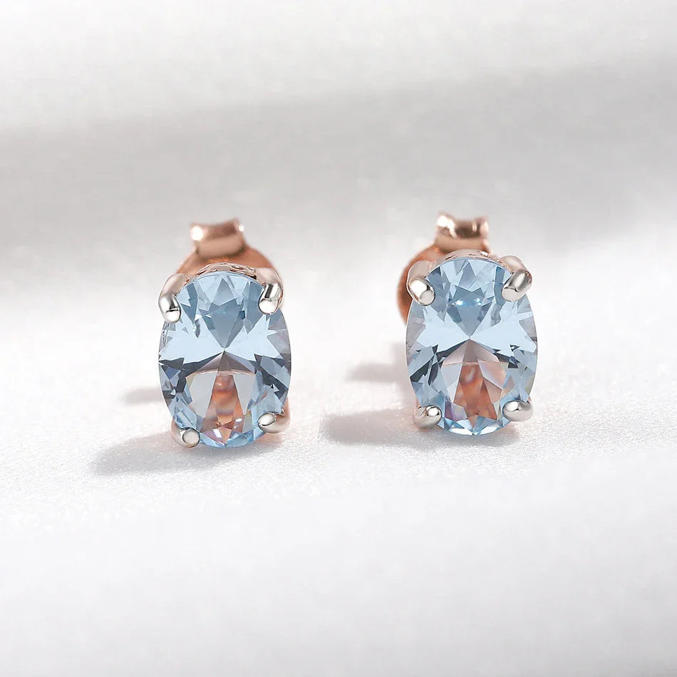 Geometrically simple sterling silver earrings in a rose gold finish, showcasing a minimalist and elegant design