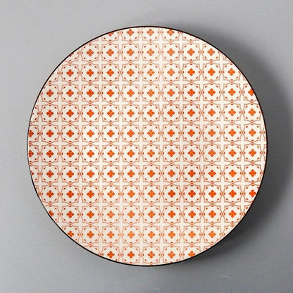 Elegant ceramic plates with vibrant, whimsical prints in a variety of enchanting designs