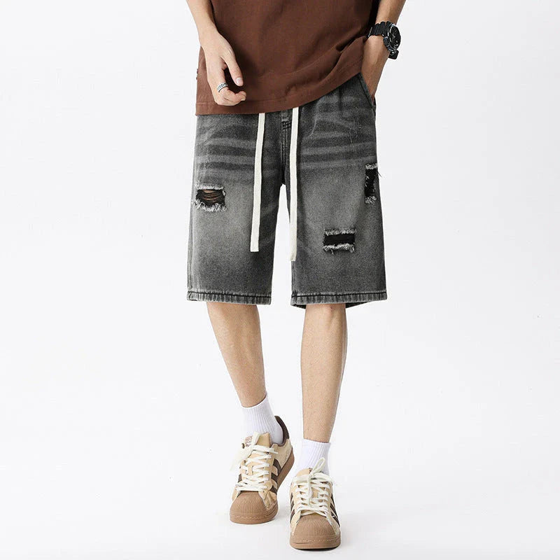 Premium British-crafted vintage-inspired ripped denim shorts for men with a straight-leg silhouette and authentic distressed details