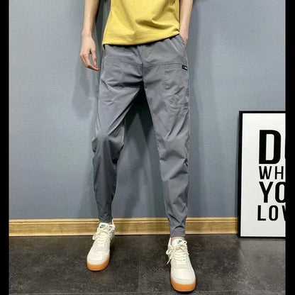 Premium slim-fit drawstring joggers in black and grey, featuring a tailored silhouette and adjustable waistband for a polished, comfortable look.