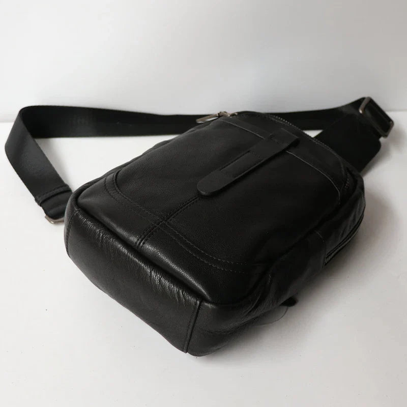 A high-quality leather chest bag in a vertical design, perfect for outdoor activities and adventures.