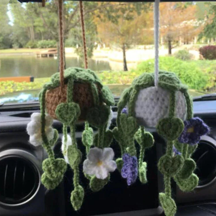 Charming knitted car plant decor with hanging white rope and green and white colour scheme