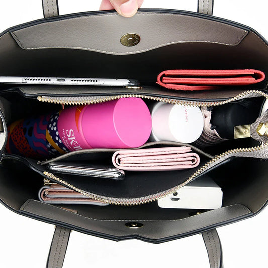 Premium cowhide crossbody handbag in black, grey, red, and yellow colours with adjustable strap and spacious compartments