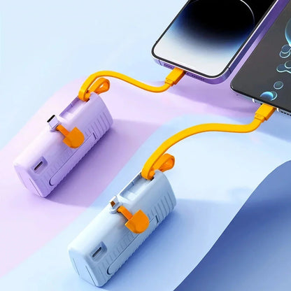 Compact, high-capacity power bank with dual charging ports and built-in cables for convenient, fast charging on the go