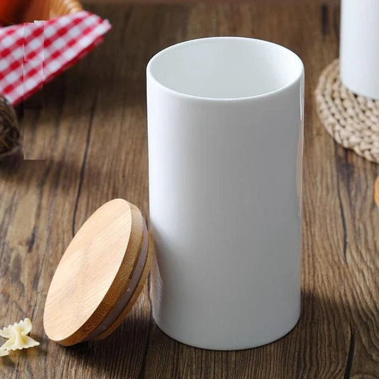 A ceramic kitchen jar with a bamboo lid, available in three sizes to suit your storage needs