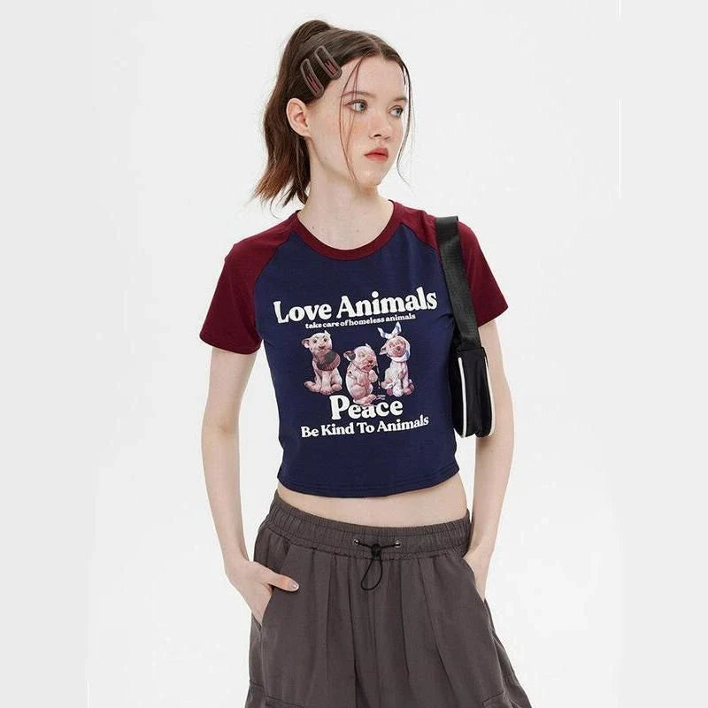 Charming Animal Print Raglan Crop Top with eye-catching graphic and contrasting sleeves