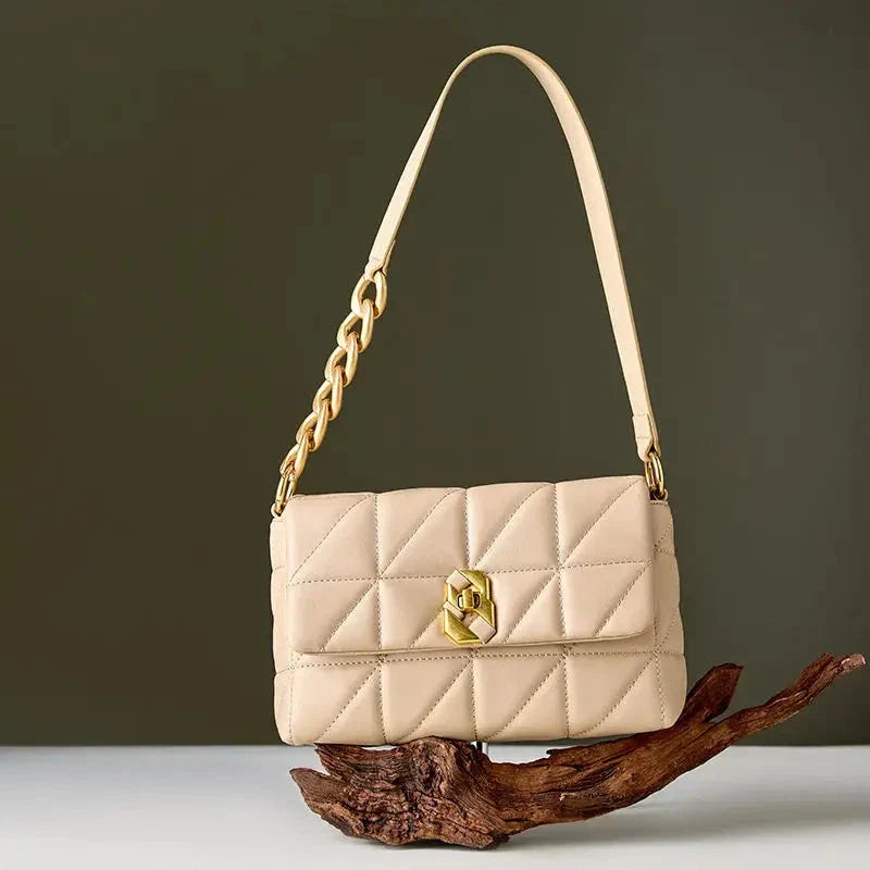 Premium genuine leather crossbody bag in a classic white colour, featuring an adjustable strap and a spacious interior with a zipper pocket.