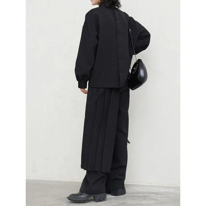 Fashionable pleated sweatshirt and wide-leg trousers set in grey, featuring a relaxed, comfortable silhouette and modern design.