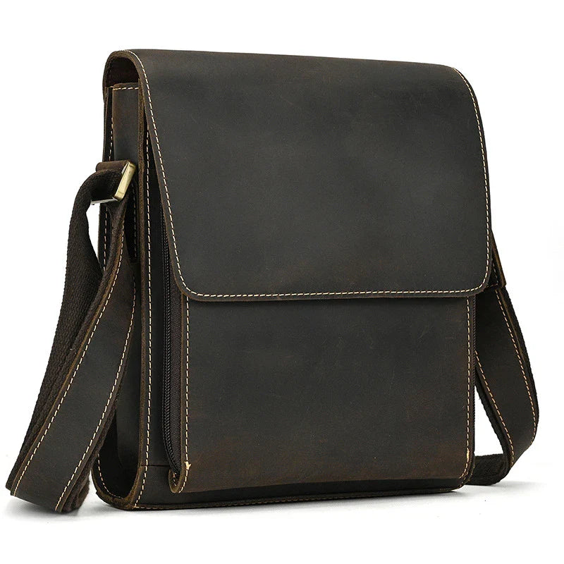 Premium leather crossbody bag with flap closure, vertical square shape, and multiple interior compartments
