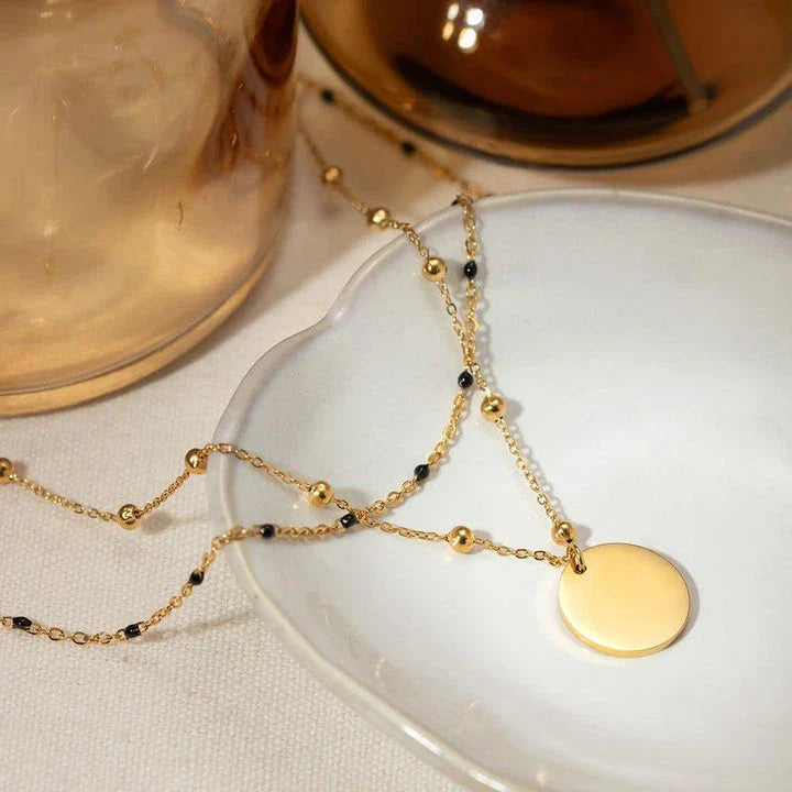 Elegant 18K gold plated black rice bead necklace, a sophisticated accessory for stylish women in the UK