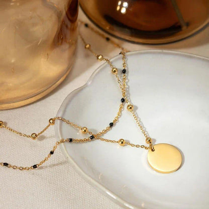 Elegant 18K gold plated black rice bead necklace, a sophisticated accessory for stylish women in the UK