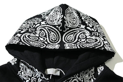 A cosy, fleece-lined hoodie with a classic paisley pattern, a relaxed fit, and practical side pockets for easy style and comfort.