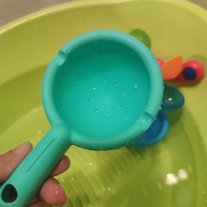 Colourful children's bath toy with a turning windmill and spoon for imaginative water play