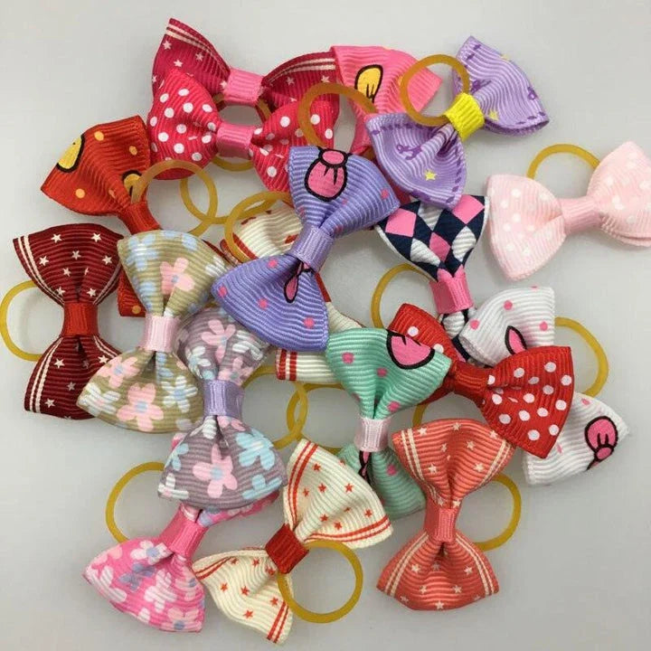 Colourful pet hair bows in assorted colours, made with premium ribbon and rubber for a secure and comfortable fit.