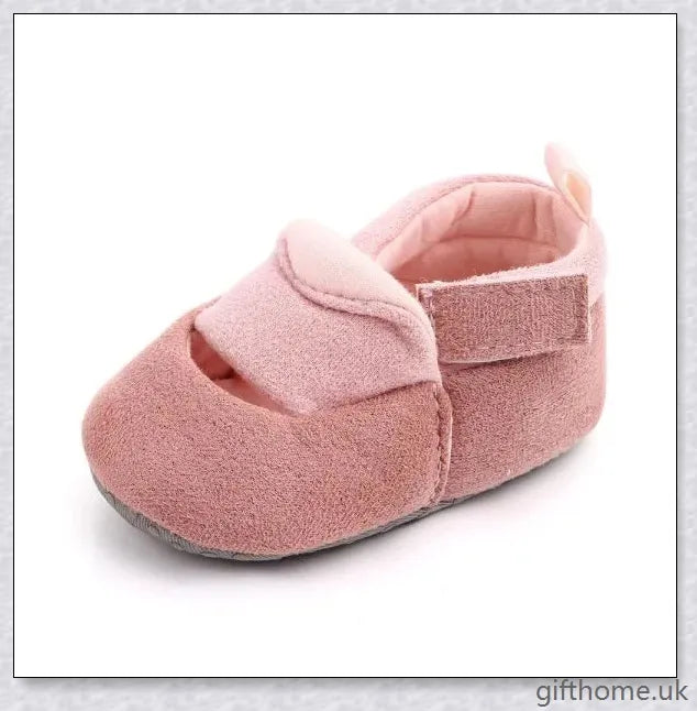 Charming baby toddler shoes with a stylish bowknot design, featuring a breathable cotton upper and non-slip sole for comfort and security.