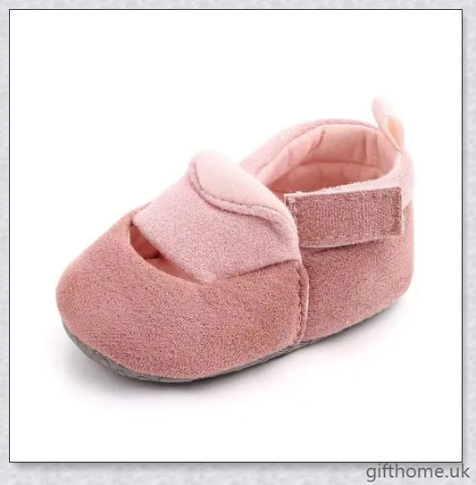 Charming baby toddler shoes with a stylish bowknot design, featuring a breathable cotton upper and non-slip sole for comfort and security.