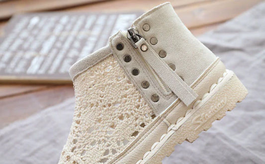 Stylish flat-soled women's Martin boots in grey and beige colours, featuring a durable denim upper and sturdy rubber sole for all-day comfort and support.