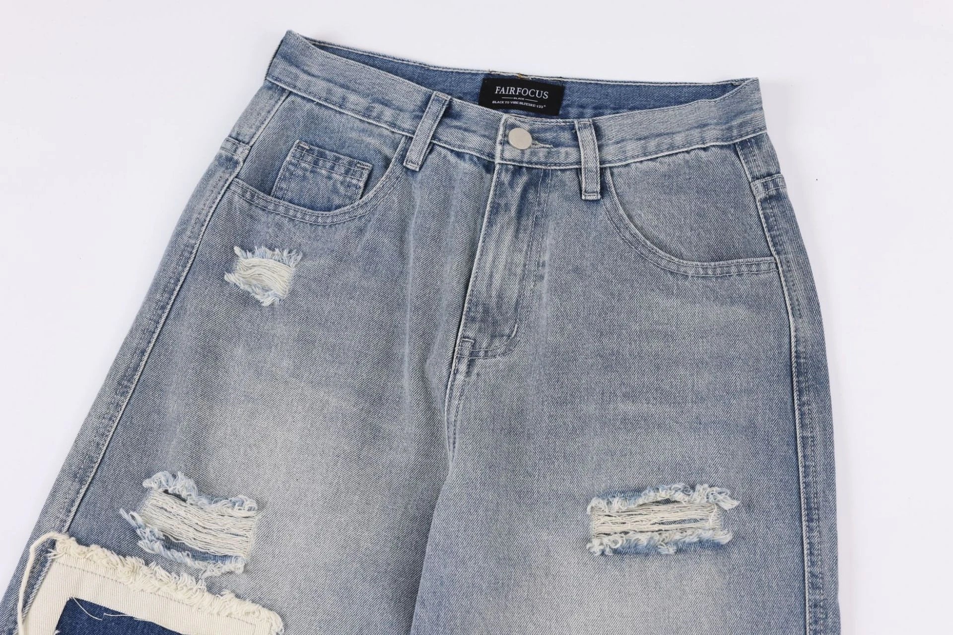 Premium heavy-duty straight-fit British denim jeans with distressed detailing and a versatile silhouette