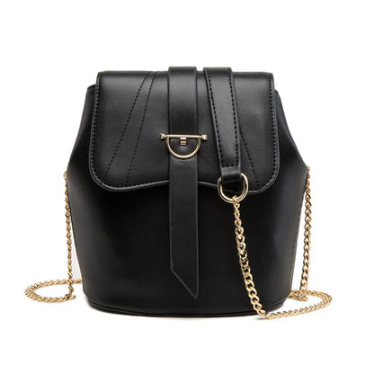 A large capacity chain bag with a classic bucket silhouette, crafted from premium leather-look material for sophisticated British style.