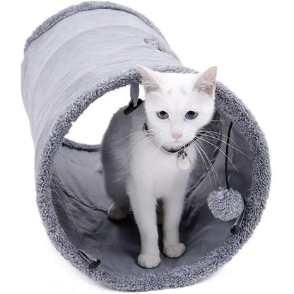 A collapsible cat tunnel made of crinkle suede with a peek-a-boo hole and dangling ball, providing a stimulating and entertaining play experience for cats.