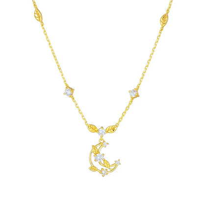 Elegant crescent moon necklace with intricate leaf design in a gleaming gold tone