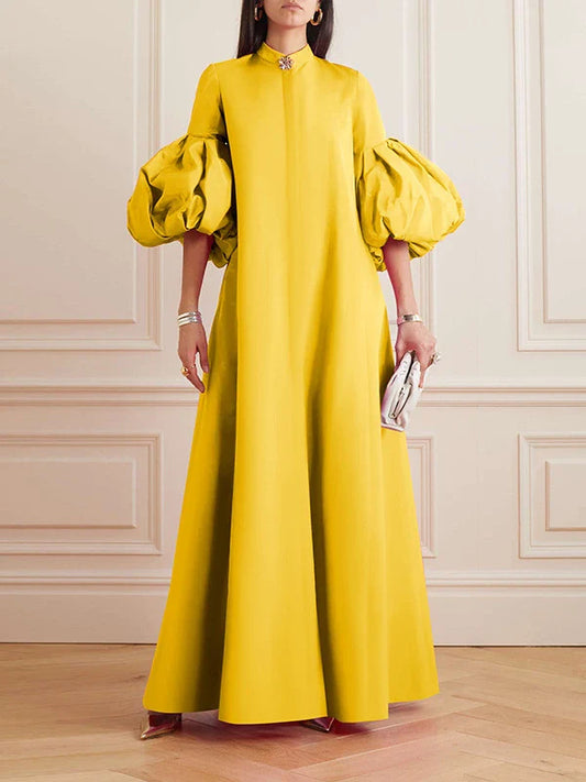 Elegant floral evening gown in a range of vibrant colours, featuring a loose, flattering fit and chic lapel design