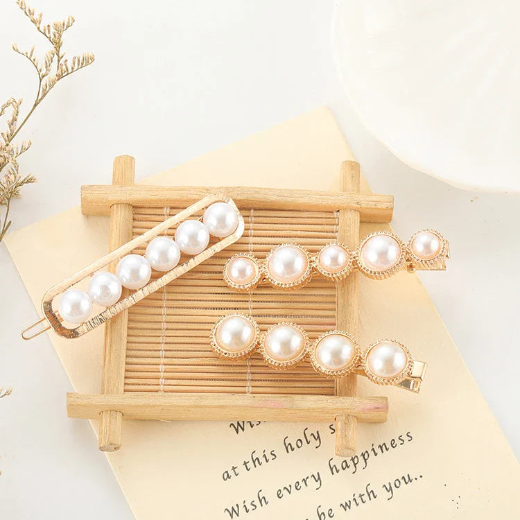 Elegant silver-toned hair clip with a beautiful pearl flower design, a timeless British-inspired accessory