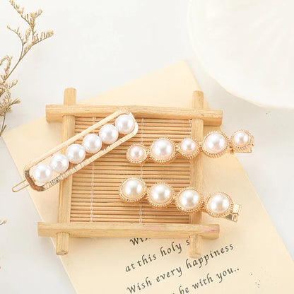Elegant silver-toned hair clip with a beautiful pearl flower design, a timeless British-inspired accessory